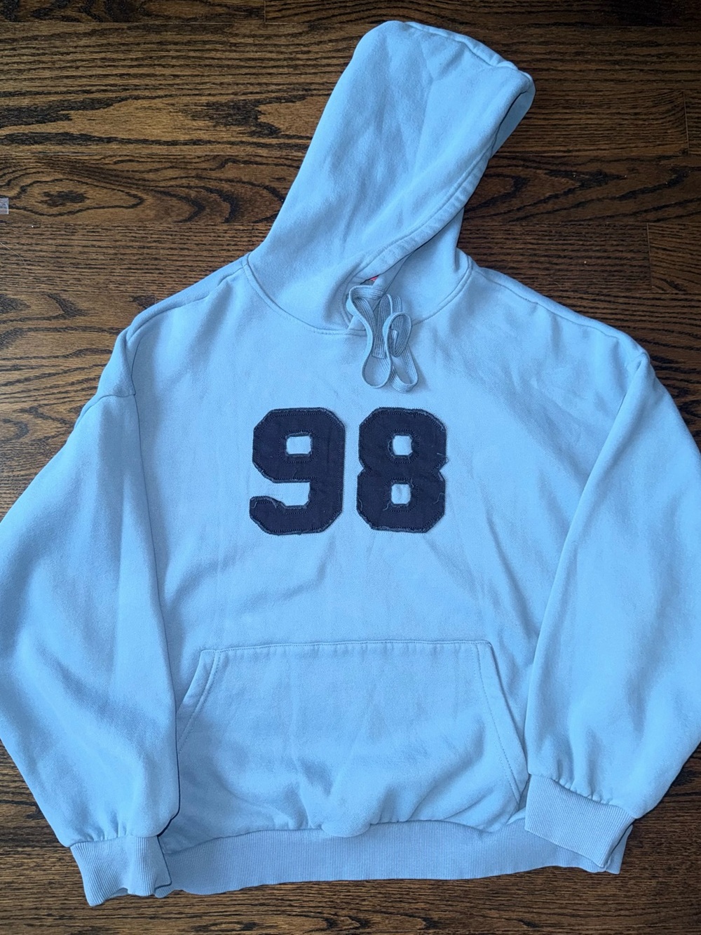 Light Blue Hooded Sweatshirt with '98' Patch